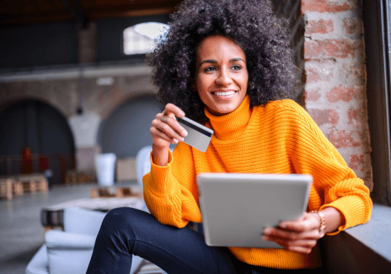 Image of woman with credit card and laptop