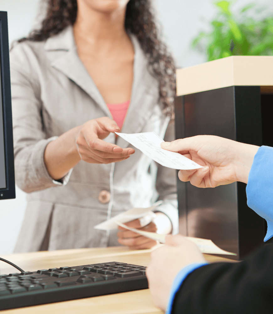 A women is recieving reciept in Tiaa bank